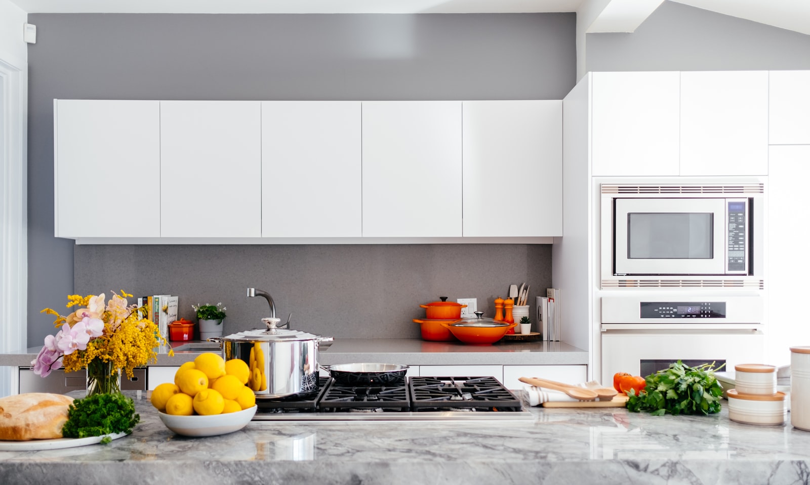 A clean, bright kitchen with a bowl of lemons and fresh flowers (placeholder photo)